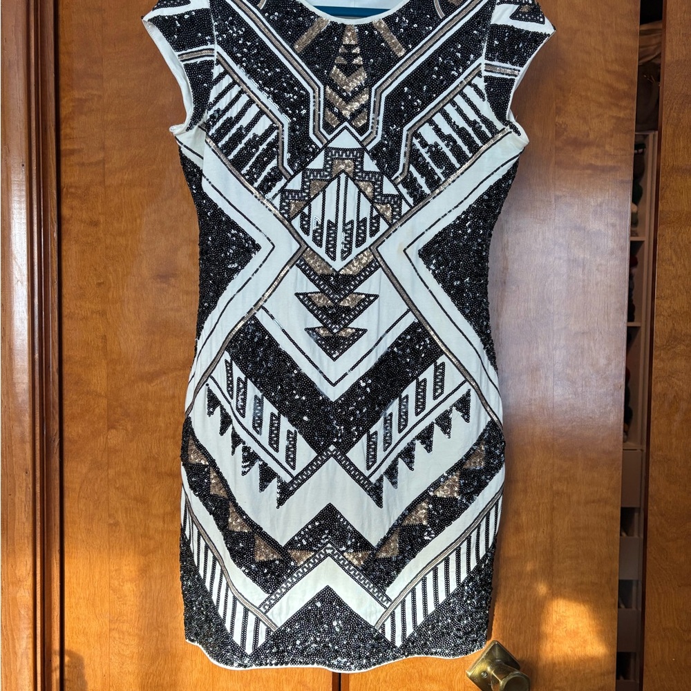 Express form fitting Black and White Geometric Mini Dress.